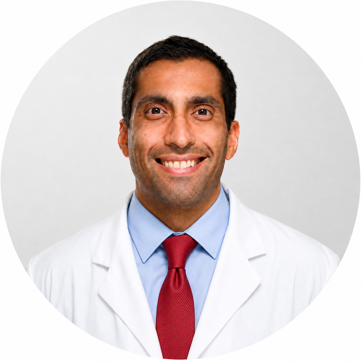 Doctor in white coat smiling portrait | medhaus health